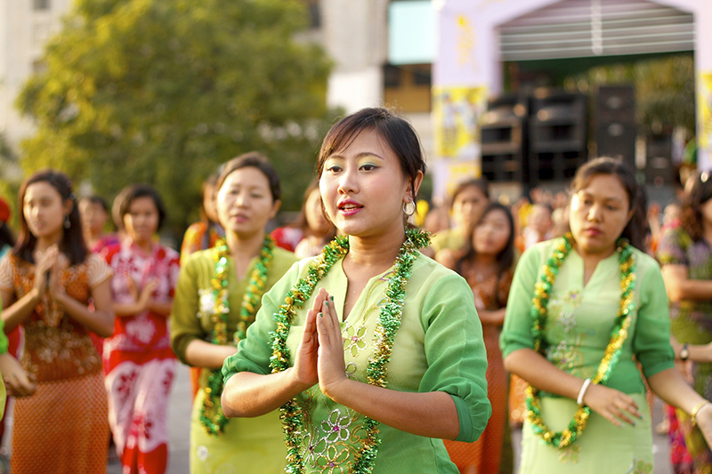 Burmese girls perform traditional dance during closing ceremony of Myanmar New Year Water Festival 2011 in Yangon, Myanmar